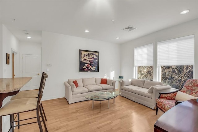 living room with light hardwood / wood-style floors