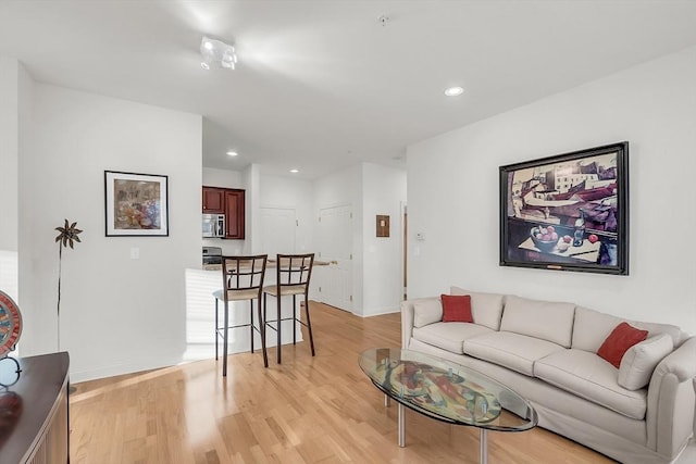 living room featuring light wood-type flooring