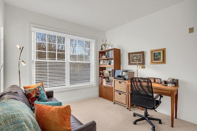 office area featuring a healthy amount of sunlight and light carpet