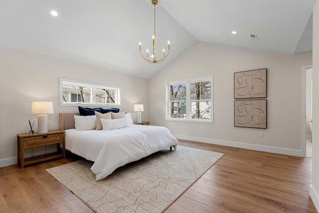 bedroom featuring lofted ceiling, a notable chandelier, visible vents, and light wood finished floors