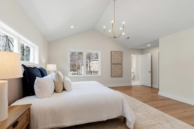 bedroom with lofted ceiling, light wood-style flooring, a notable chandelier, and baseboards