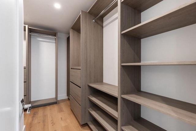 walk in closet featuring light wood-type flooring