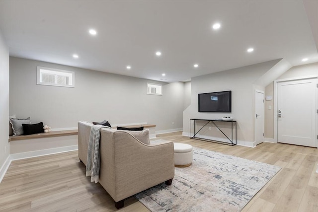 living room with recessed lighting, light wood-style floors, and baseboards