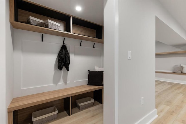 mudroom with recessed lighting, baseboards, and wood finished floors