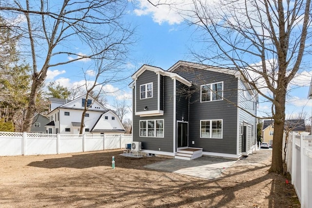 rear view of property with a patio area, ac unit, and a fenced backyard