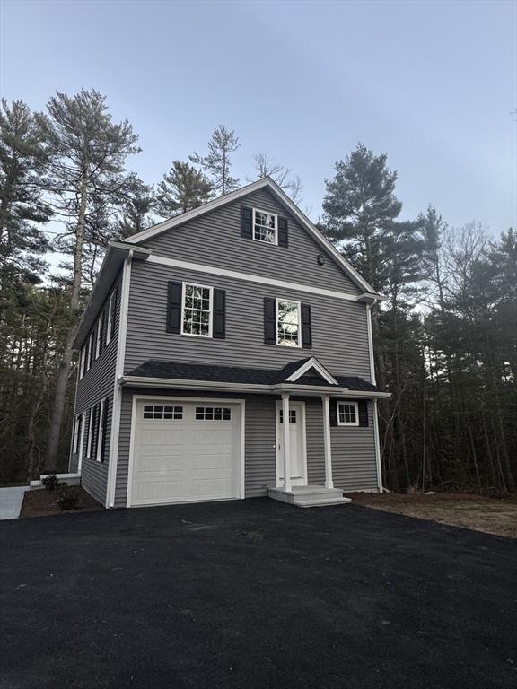 view of property featuring a garage