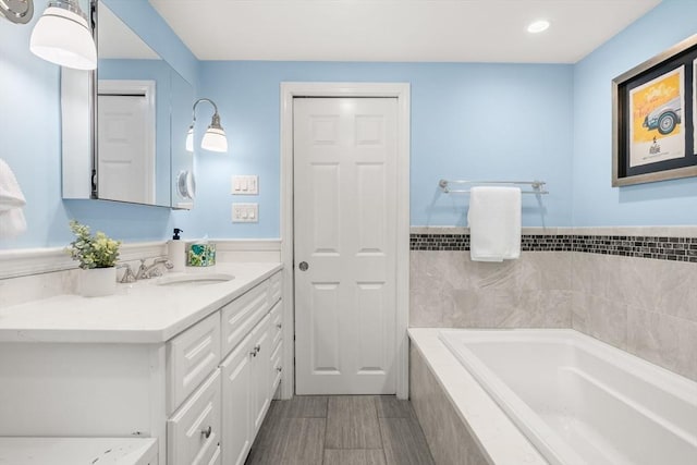 15 University Rd, Arlington, MA 02474 - full bath with a garden tub, vanity, and recessed lighting