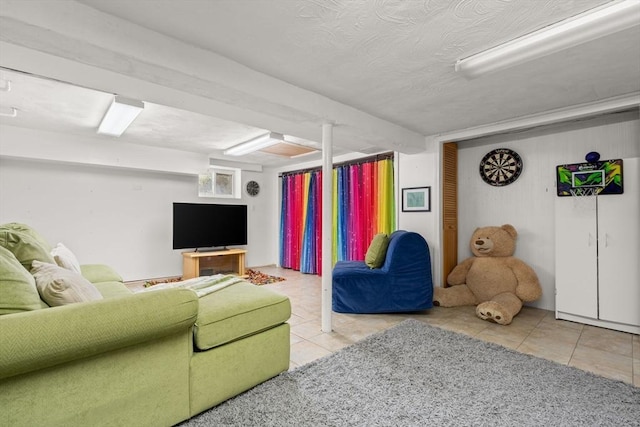 15 University Rd, Arlington, MA 02474 - living area with tile patterned flooring and a textured ceiling