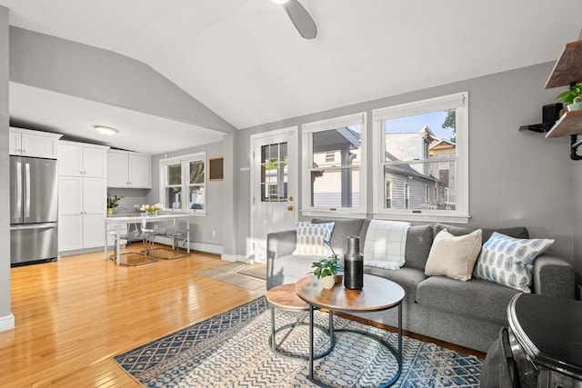 15 University Rd, Arlington, MA 02474 - living area featuring vaulted ceiling, light wood-style floors, ceiling fan, and baseboards