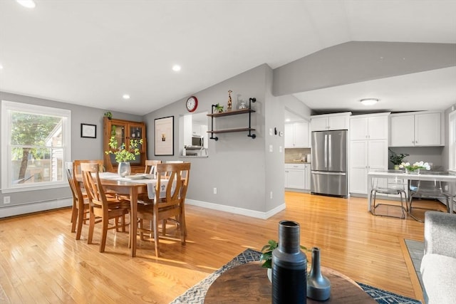 15 University Rd, Arlington, MA 02474 - dining room featuring vaulted ceiling, light wood finished floors, recessed lighting, baseboard heating, and baseboards