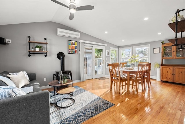 15 University Rd, Arlington, MA 02474 - dining room featuring an AC wall unit, lofted ceiling, light wood finished floors, a ceiling fan, and baseboards