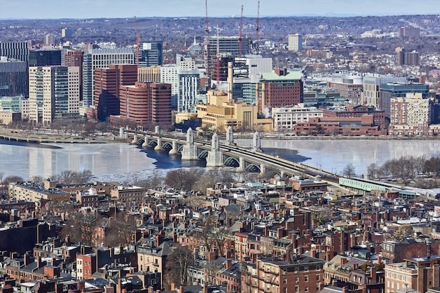 property's view of city featuring a water view