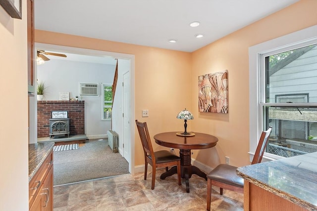 20 Walden St, Lowell, MA 01851 - dining area featuring radiator heating unit, ceiling fan, baseboards, a wood stove, and recessed lighting