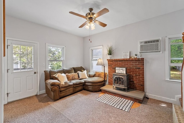 20 Walden St, Lowell, MA 01851 - living room featuring a wall unit AC, plenty of natural light, a ceiling fan, and baseboards