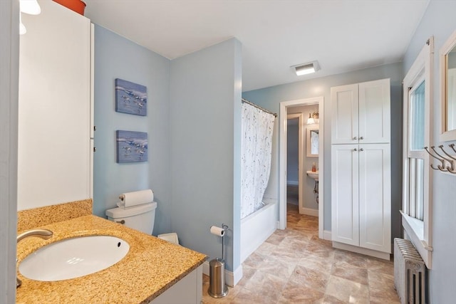 20 Walden St, Lowell, MA 01851 - full bathroom with radiator, vanity, toilet, and shower / bath combo with shower curtain