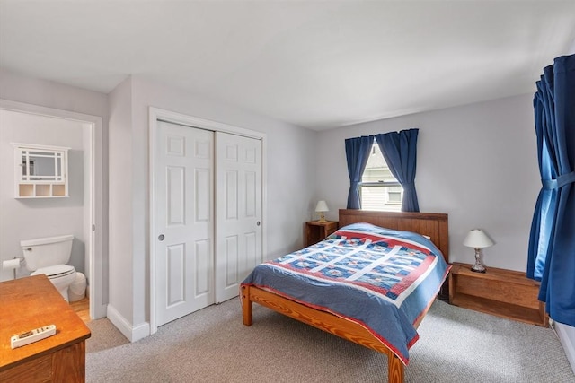 20 Walden St, Lowell, MA 01851 - carpeted bedroom featuring a closet and baseboards