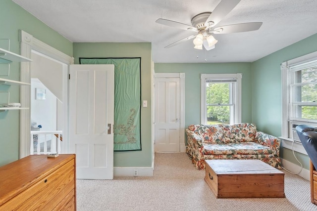 20 Walden St, Lowell, MA 01851 - living room with baseboards, ceiling fan, and carpet floors
