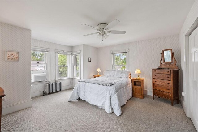 20 Walden St, Lowell, MA 01851 - bedroom featuring radiator, wallpapered walls, light colored carpet, ceiling fan, and cooling unit