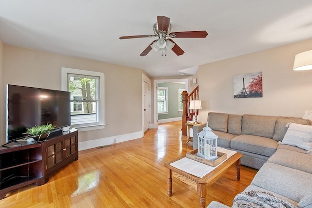 20 Walden St, Lowell, MA 01851 - living room with stairs, plenty of natural light, baseboards, and a ceiling fan