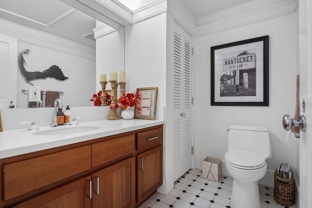 bathroom with toilet and vanity