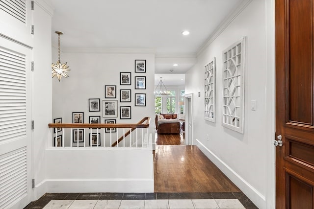 hallway featuring hardwood / wood-style flooring and crown molding