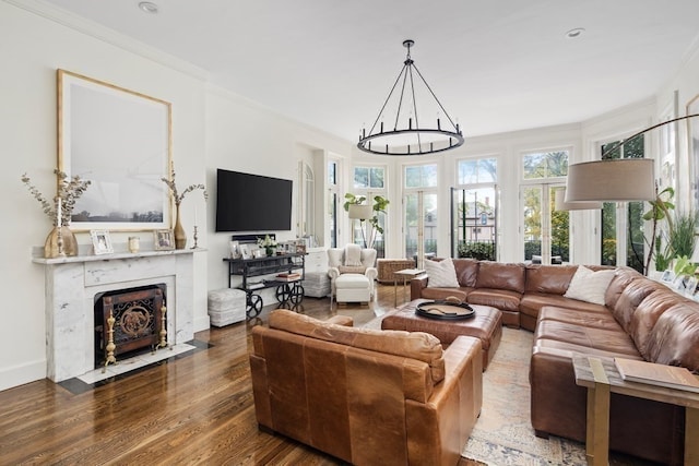 living room featuring ornamental molding, dark hardwood / wood-style floors, and a high end fireplace