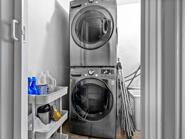 laundry area featuring laundry area and stacked washer and dryer