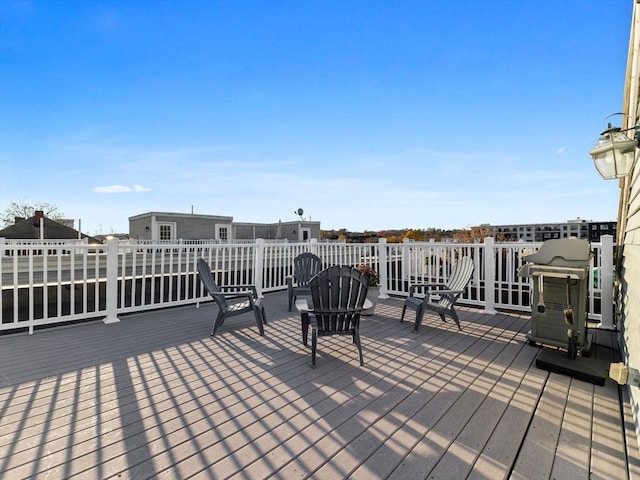 wooden terrace with area for grilling