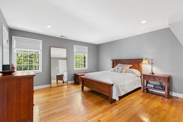 bedroom featuring recessed lighting, baseboards, visible vents, and light wood-style flooring