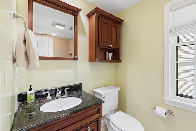 bathroom with toilet and vanity