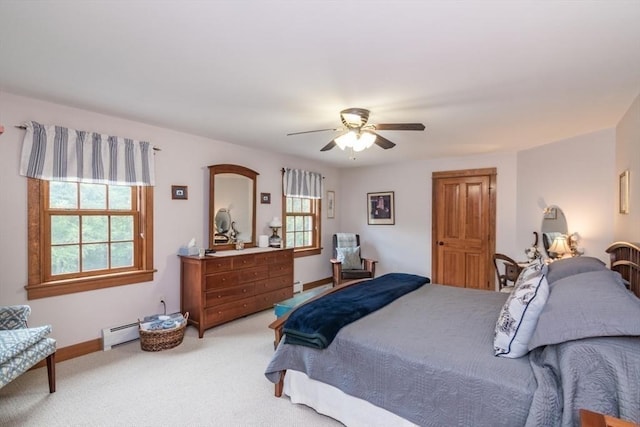 137 French King Hwy, Gill, MA 01354 - bedroom with a baseboard heating unit, multiple windows, light colored carpet, and ceiling fan