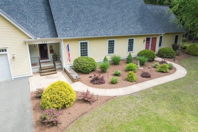 137 French King Hwy, Gill, MA 01354 - cape cod-style house featuring roof with shingles, a porch, and a front yard