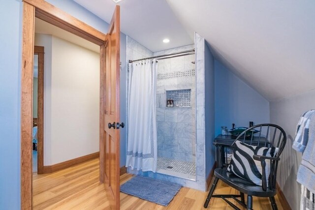 137 French King Hwy, Gill, MA 01354 - full bath featuring tiled shower, wood finished floors, vaulted ceiling, baseboards, and recessed lighting