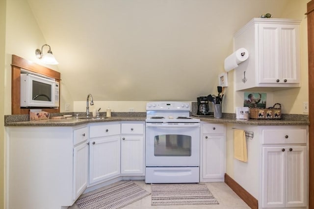 137 French King Hwy, Gill, MA 01354 - kitchen with white appliances, a sink, white cabinets, lofted ceiling, and light tile patterned floors