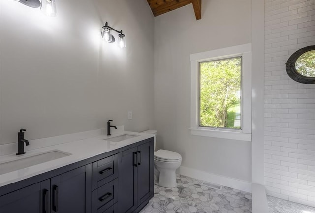 7 Cove Way, Gloucester, MA 01930 - full bathroom with toilet, double vanity, tile patterned floors, a tile shower, and baseboards