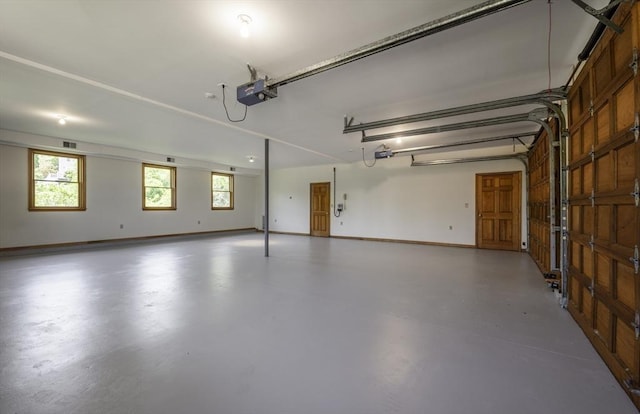7 Cove Way, Gloucester, MA 01930 - garage with a garage door opener and baseboards