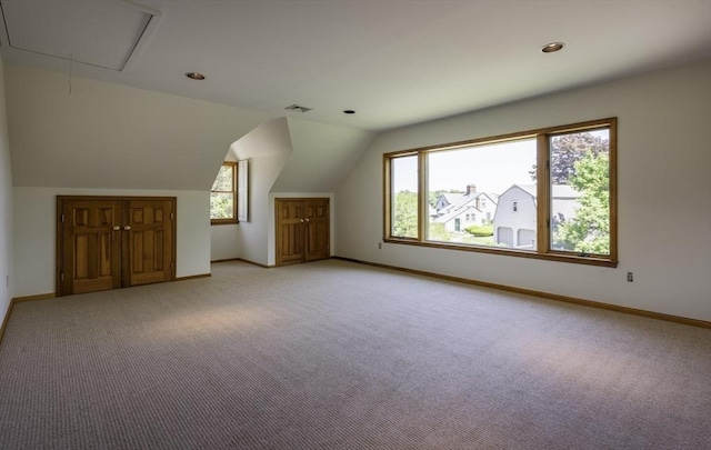 7 Cove Way, Gloucester, MA 01930 - additional living space featuring light colored carpet, baseboards, attic access, lofted ceiling, and recessed lighting