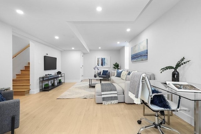 living area featuring light wood finished floors, stairway, recessed lighting, and baseboards