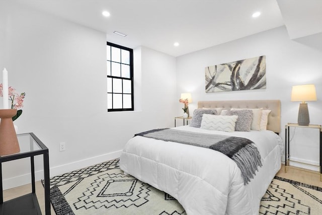 bedroom with baseboards and recessed lighting