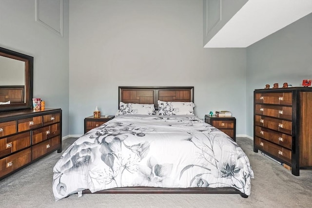 bedroom featuring baseboards and carpet flooring