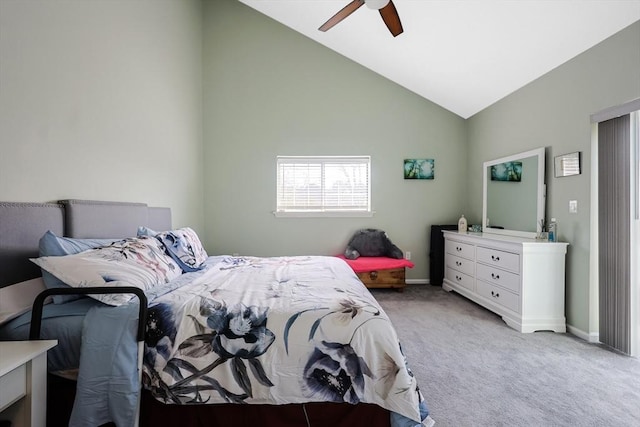 carpeted bedroom with vaulted ceiling, baseboards, and a ceiling fan