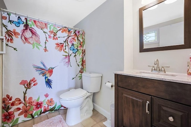full bathroom featuring tile patterned floors, vaulted ceiling, toilet, vanity, and baseboards