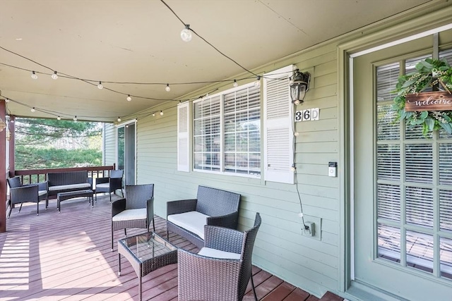 deck with an outdoor hangout area