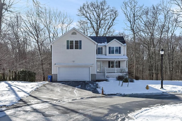 front facade featuring a garage and a porch