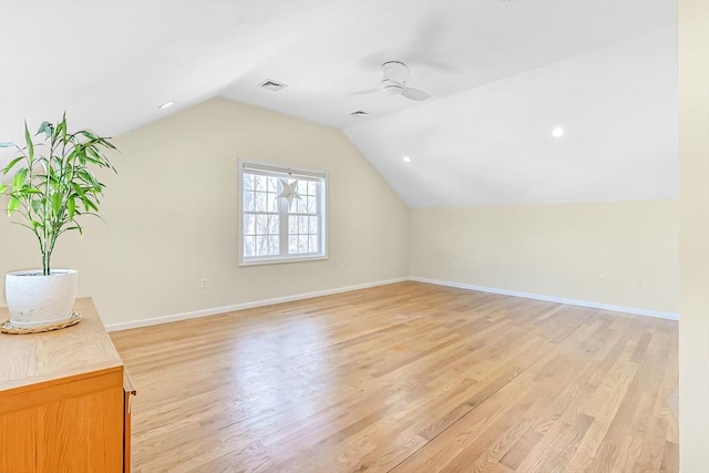 bonus room with ceiling fan, lofted ceiling, and light wood-type flooring