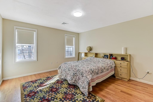 bedroom with light wood-type flooring