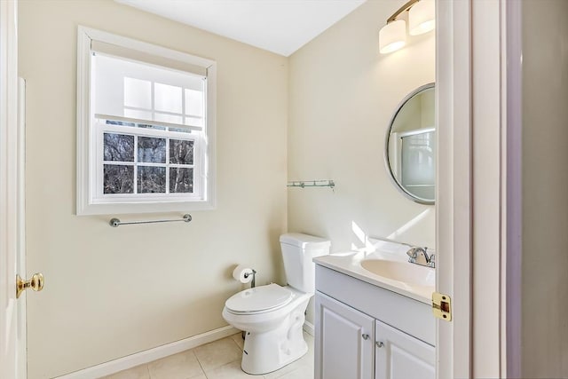 bathroom with vanity, toilet, and tile patterned flooring