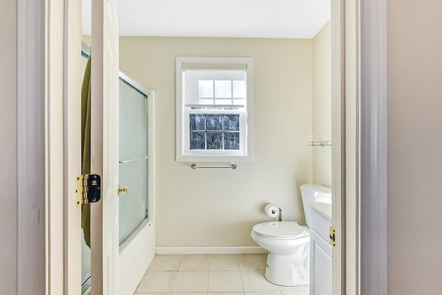 full bathroom with shower / bath combination with glass door, tile patterned floors, toilet, and vanity