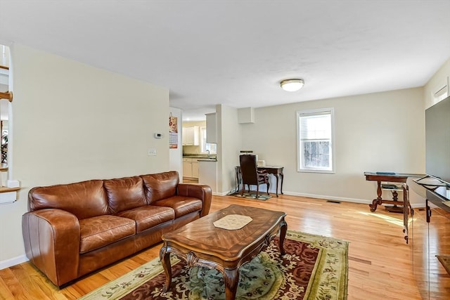 living room featuring light wood-type flooring