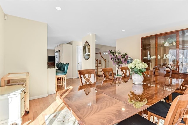 dining area with light hardwood / wood-style floors